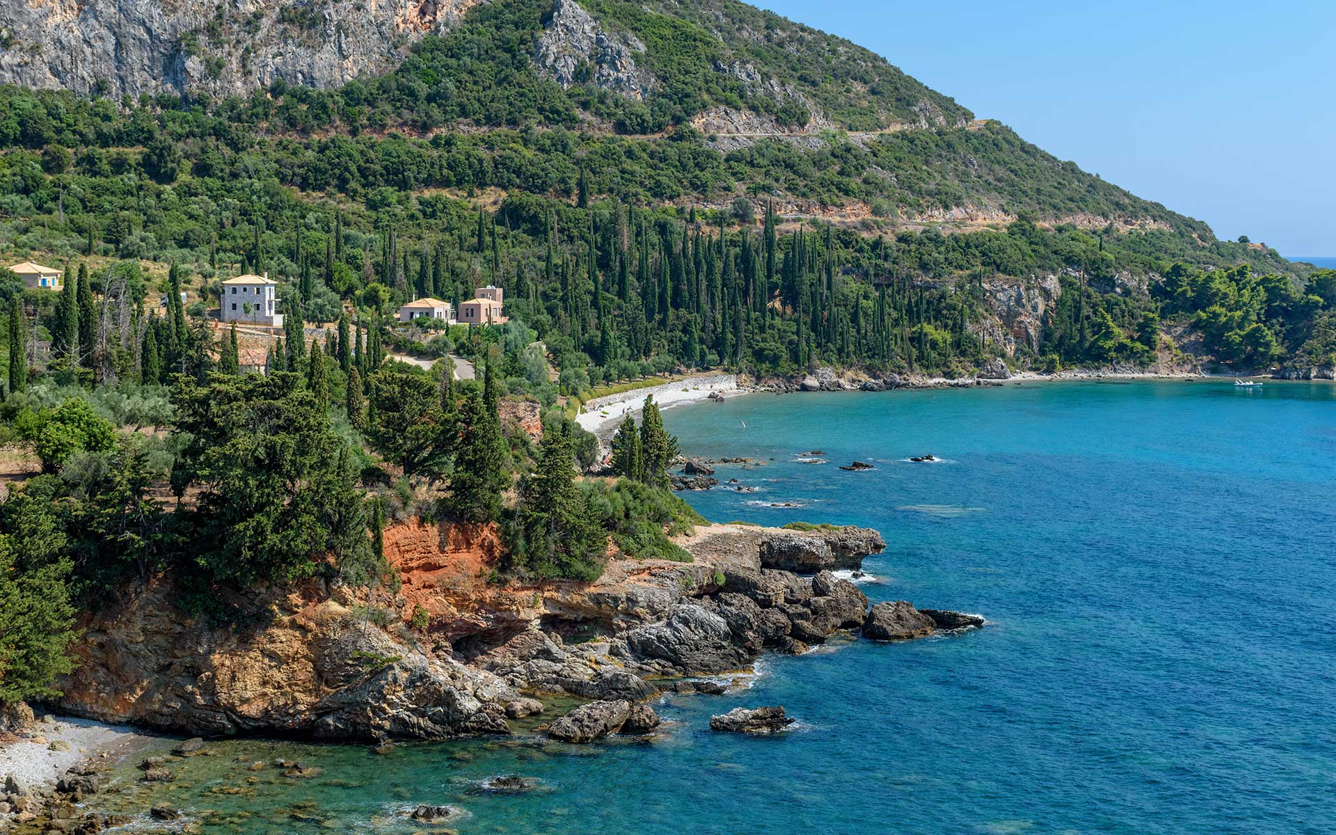 Rocky Mani coastline with Mediterranean vegetation and clear blue water